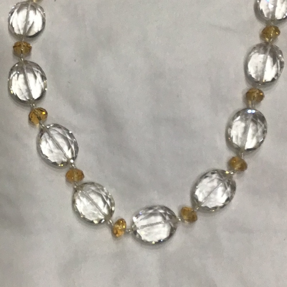 Beautiful faceted clear and amber colored beaded necklace. Worn 2 x